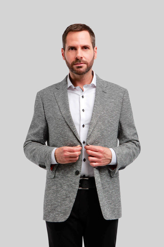The Arlington Grey Knit Blazer sports a luxurious knit chenille fabric that is super soft to the touch and provides a beautiful drape. This textured sport coat is light enough in weight to wear year round, and has lots of stretch for added comfort in your day to day.