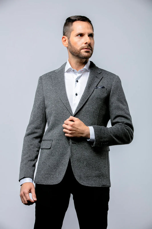 The Adler is a grey knit sport coat with some subtle black and white flecking, making it wearable with just about any colour combination you can think of. This sport coat is made using a wool, polyester, and cotton jersey fabrication,& giving you the ability to be fashionable without sacrificing comfort.
