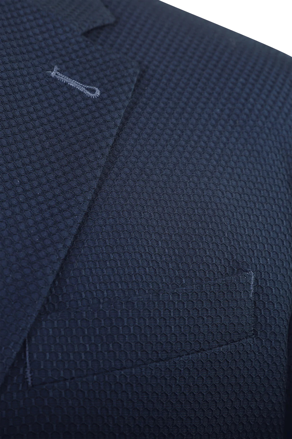 A blue blazer, but with a honeycomb stitch overtop, giving an almost three dimensional design to the coat. Like most 7 Downie St. sport coats, the Aragon has a generous amount of stretch, allowing you to look your best without compromising comfort.