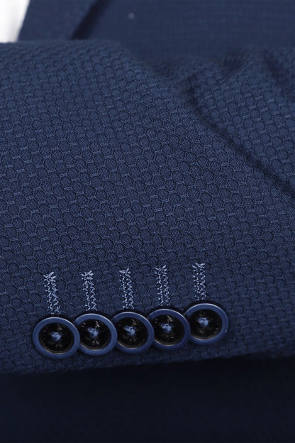 A blue blazer, but with a honeycomb stitch overtop, giving an almost three dimensional design to the coat. Like most 7 Downie St. sport coats, the Aragon has a generous amount of stretch, allowing you to look your best without compromising comfort.
