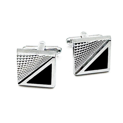 Pair of silver cufflinks with black triangle design on a white background
