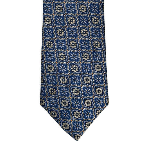 Blue patterned tie on a white background