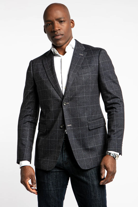 The Apollo stretch blazer is a great option to really elevate your casual sport coat game. This navy blazer with a daring yet not overstated ecru glen plaid is a fun and denim friendly jacket that will be in your rotation for years to come. Like most 7 Downie St. sport coats, the Apollo has a generous amount of stretch, allowing you to look your best without compromising comfort.