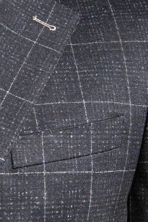 The Apollo stretch blazer is a great option to really elevate your casual sport coat game. This navy blazer with a daring yet not overstated ecru glen plaid is a fun and denim friendly jacket that will be in your rotation for years to come. Like most 7 Downie St. sport coats, the Apollo has a generous amount of stretch, allowing you to look your best without compromising comfort.