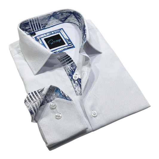 Folded white dress shirt with blue and black patterned inner lining on a white background