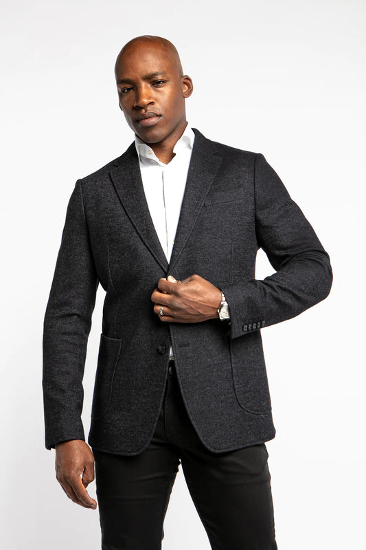 The Opium sport coat has both dark and soft blues in the fabric, making it easy to pair with both light and dark colours, giving the jacket a little more flair than a typical navy jacket. This sport coat is made using a wool, polyester, and cotton jersey fabrication, giving you the ability to be fashionable without sacrificing comfort.
