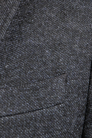 The Opium sport coat has both dark and soft blues in the fabric, making it easy to pair with both light and dark colours, giving the jacket a little more flair than a typical navy jacket. This sport coat is made using a wool, polyester, and cotton jersey fabrication, giving you the ability to be fashionable without sacrificing comfort.