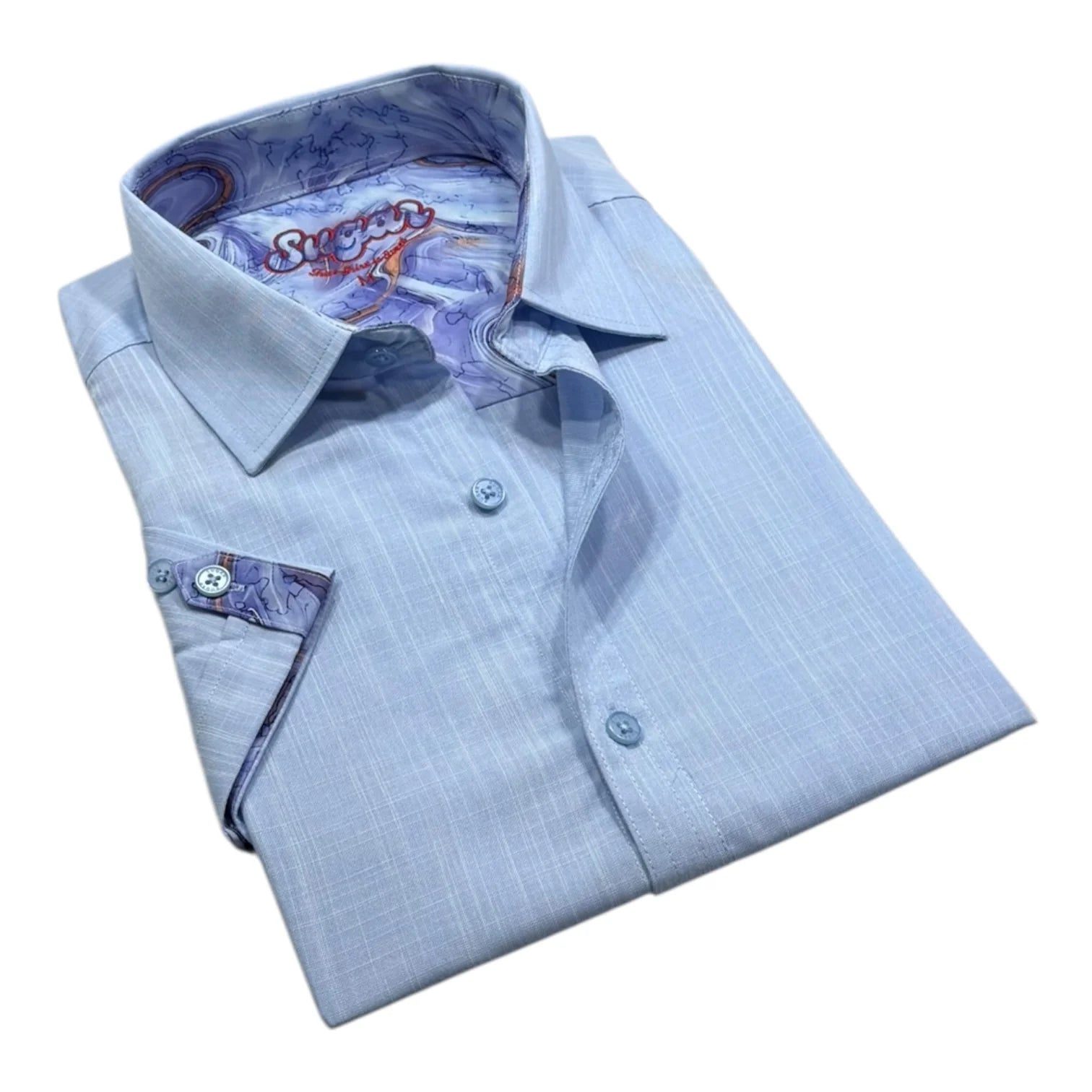 Folded light blue dress shirt with patterned lining on a white background
