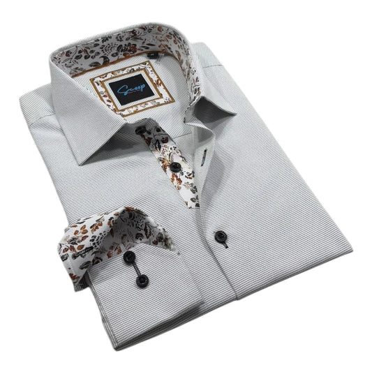 Folded gray dress shirt with floral accents on a white background