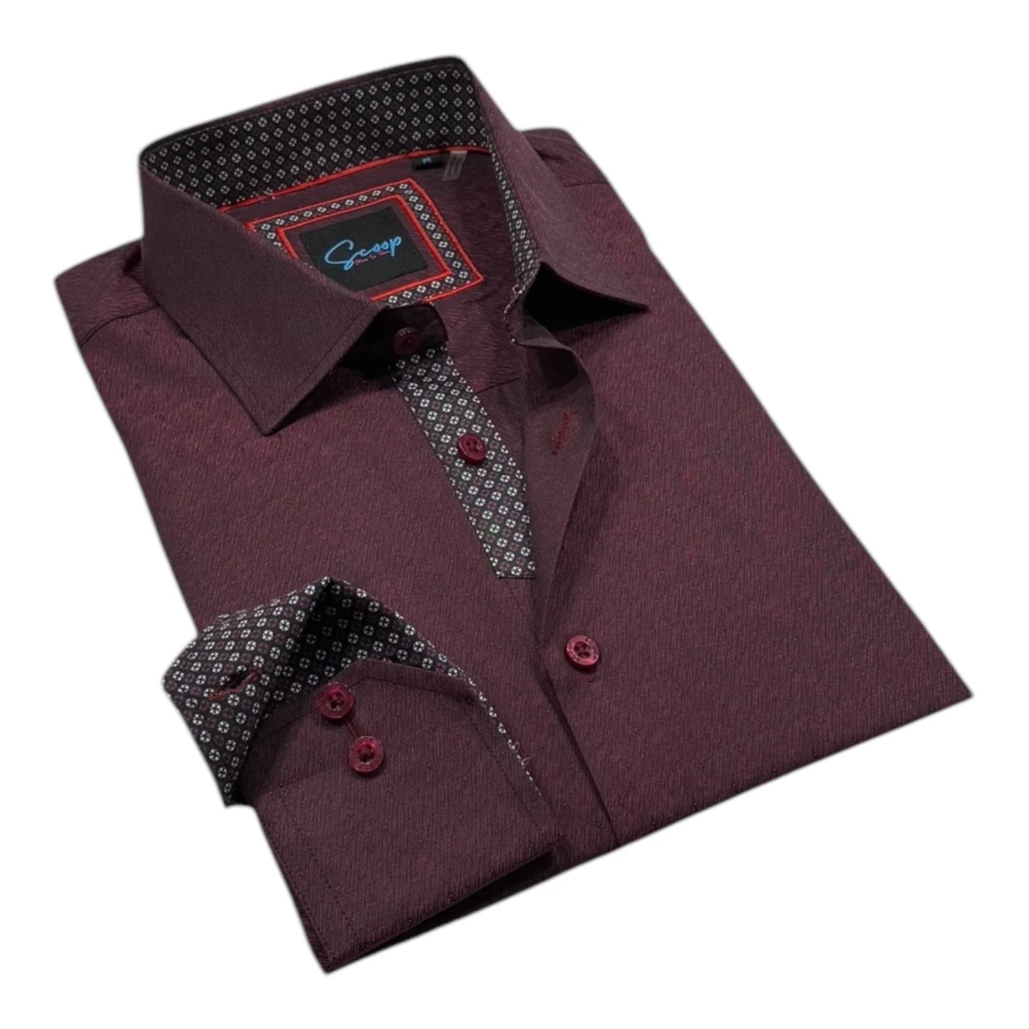 Folded maroon dress shirt with patterned inner lining on a white background
