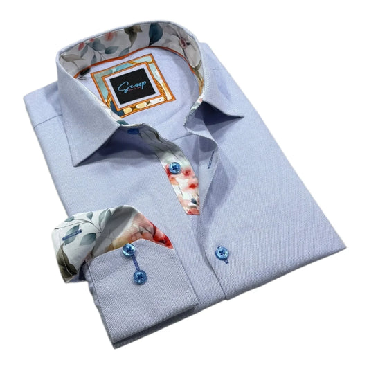 Folded light blue dress shirt with floral cuffs and collar on a white background