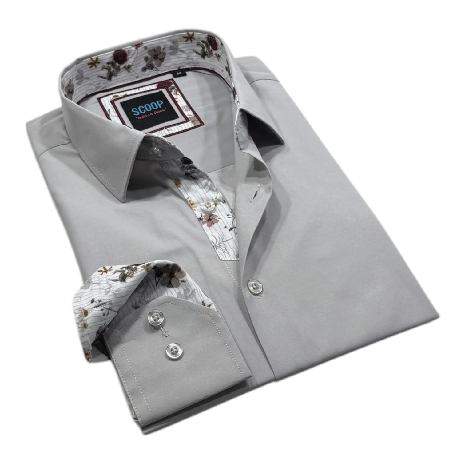 Folded gray dress shirt with floral inner lining on a white background