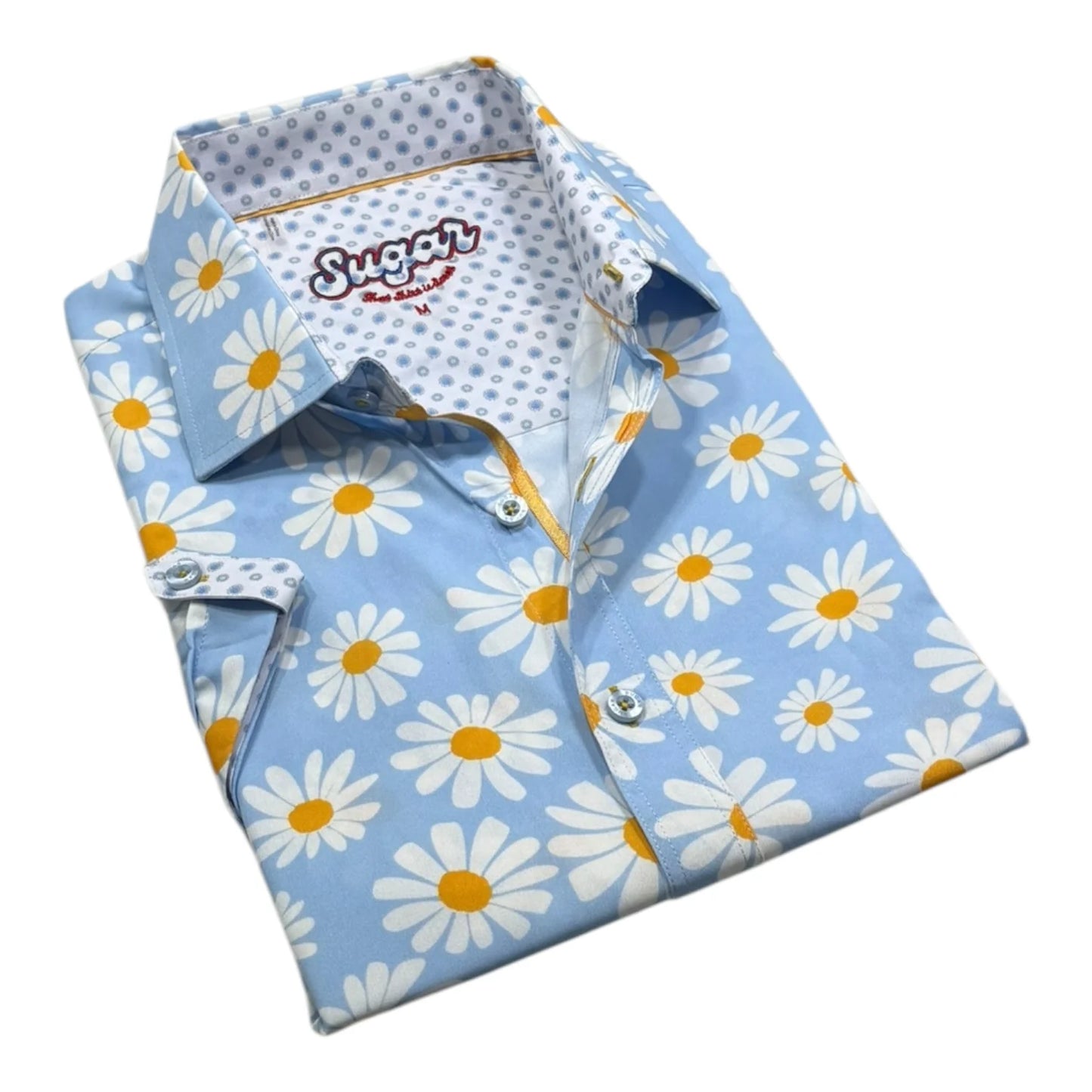 Folded shirt with daisy pattern on a light blue background
