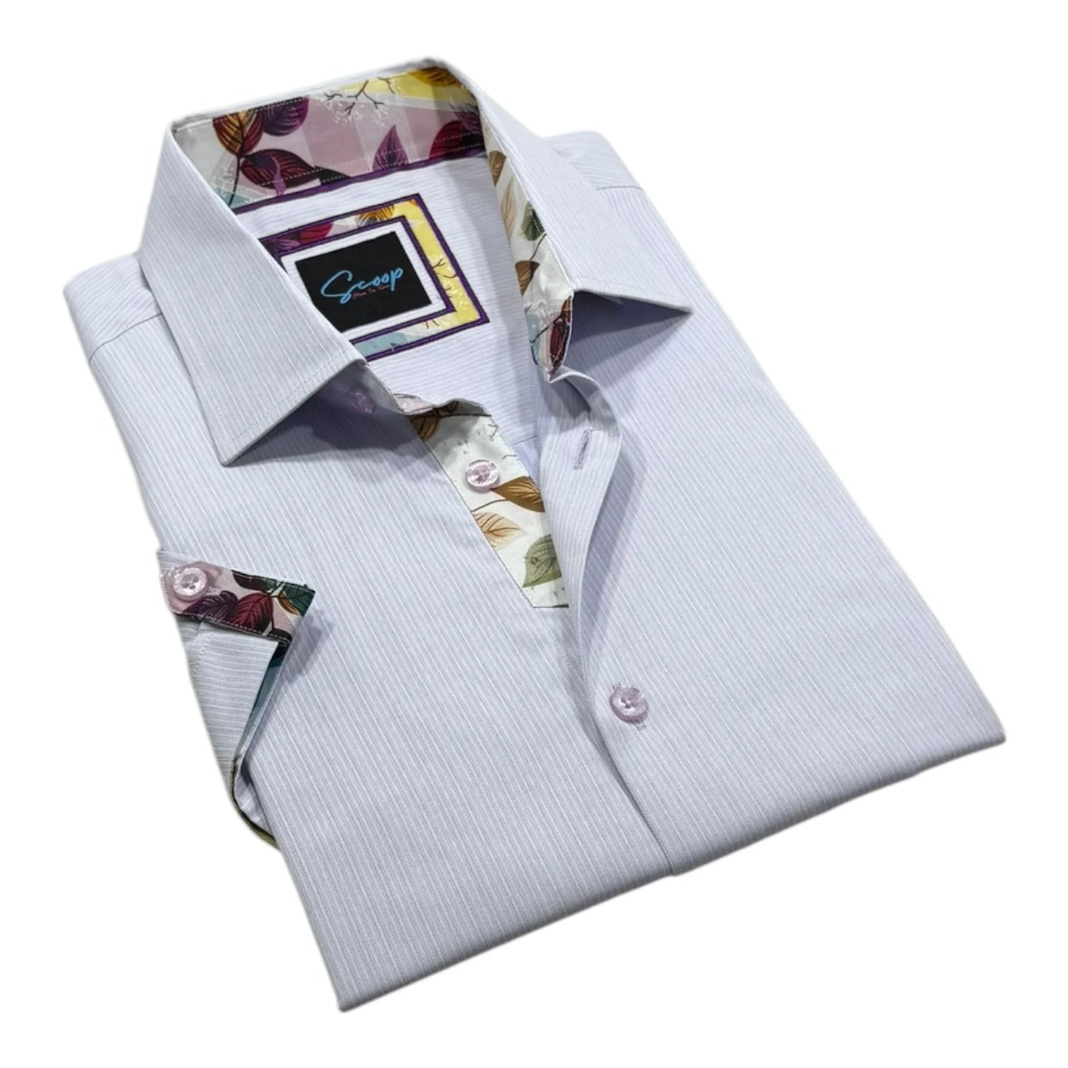 Folded light blue dress shirt with floral accents on a white background