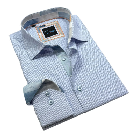Folded light blue checkered dress shirt with a brand label on a white background