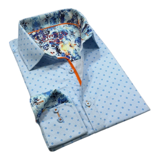 Folded dress shirt with blue geometric pattern and floral inside collar on a white background