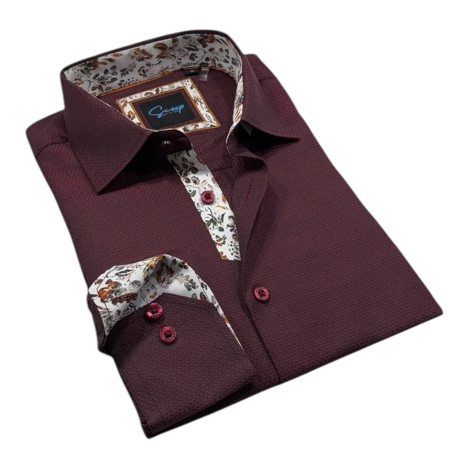 Folded maroon shirt with floral patterns on collar and cuffs against a white background