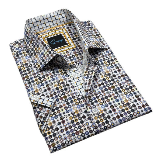 Folded patterned dress shirt with a brand label on a white background