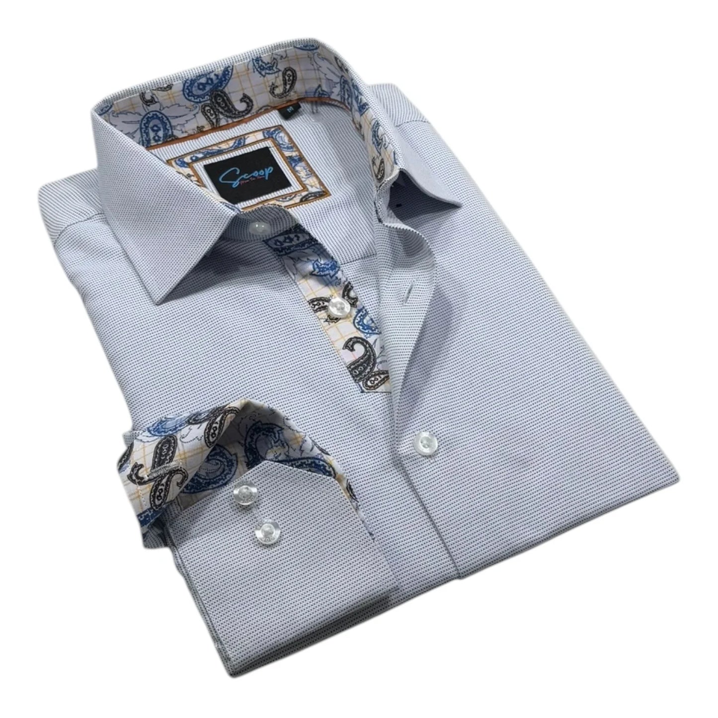 Folded light blue dress shirt with patterned inner lining and cuffs on a white background