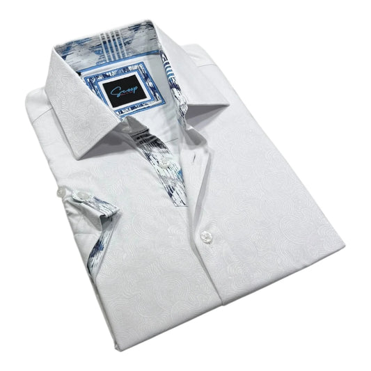 Folded white dress shirt with patterned lining on a white background