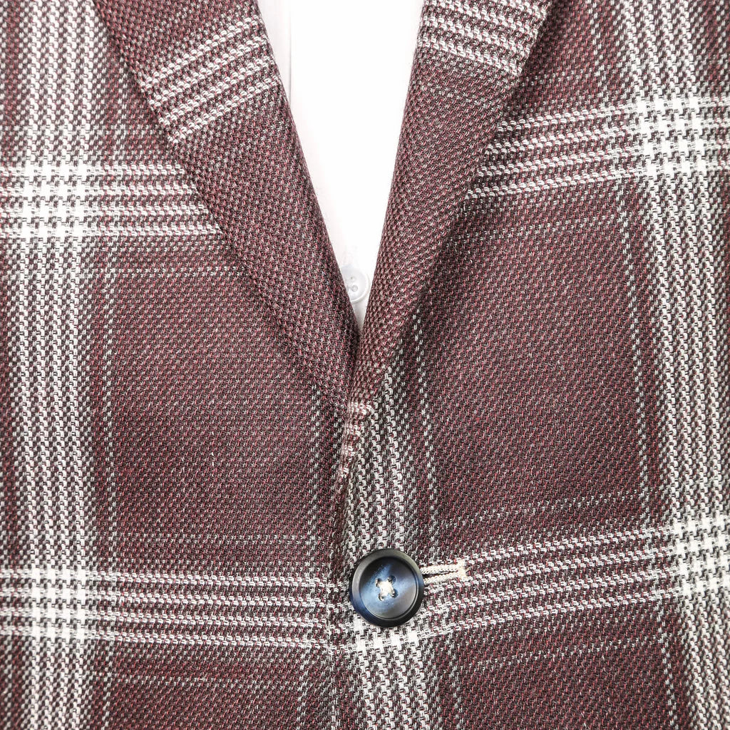 A rich and striking burgundy hue with a white exploded plaid makes the Santiago a great year round blazer. Pair with denim for a more casual look or a pair of our cotton trousers for something a little more refined.