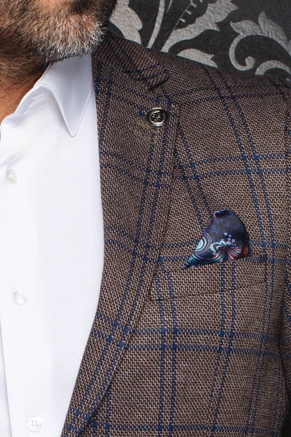 Brown checkered suit jacket with a pocket square worn by a person