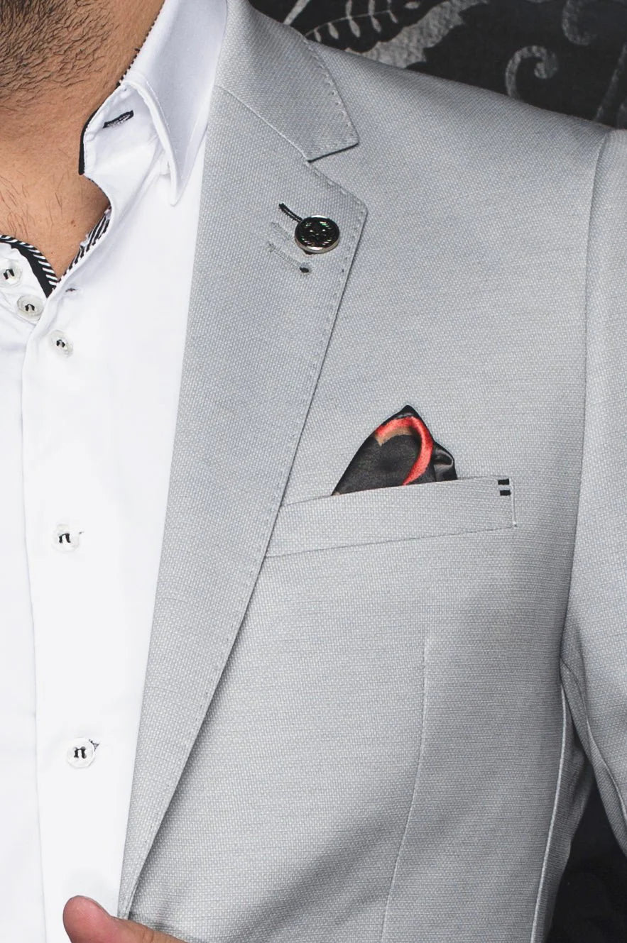 Gray suit jacket with a white shirt and red pocket square.
