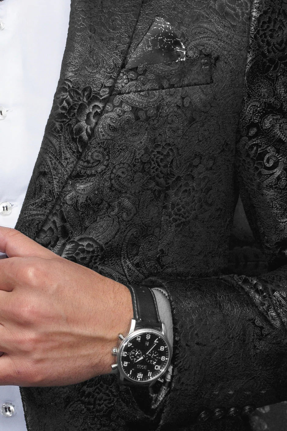 Black embroidered blazer with a watch on a person's wrist