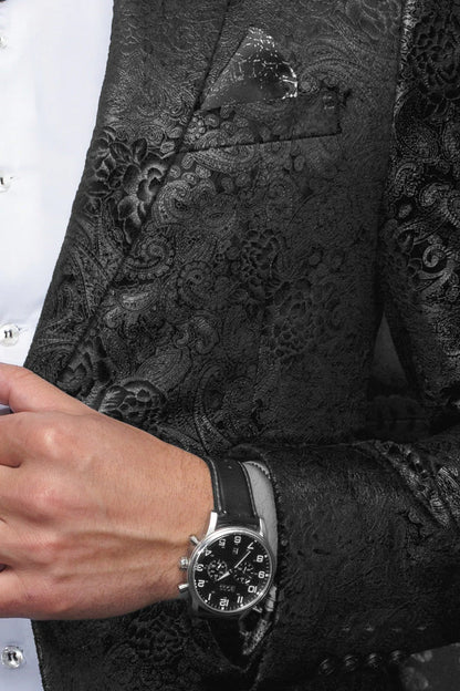Black embroidered blazer with a watch on a person's wrist